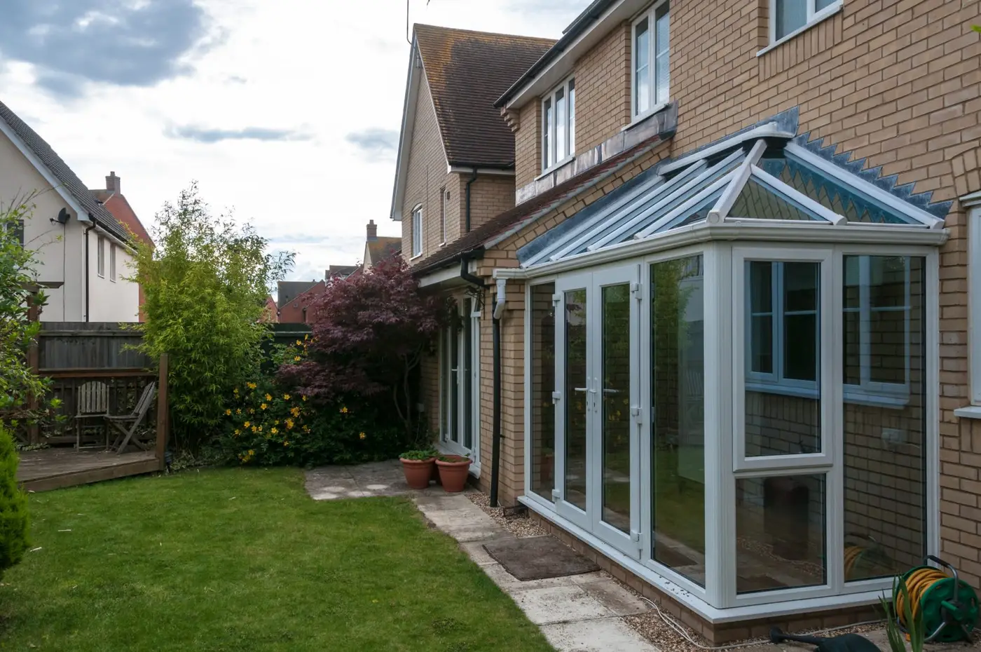 Conservatory and view of back garden in the Highlands